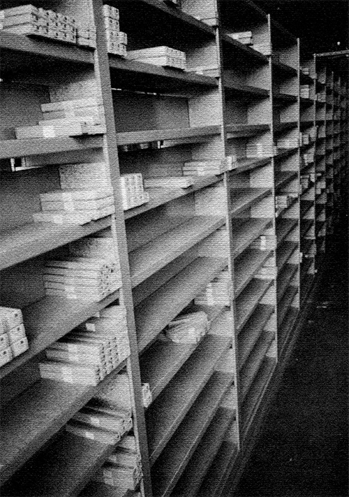 Photograph of sparse shelves of packaged fonts.