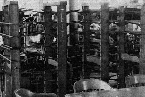 Photograph of several racks designed to hold numerous sticks.