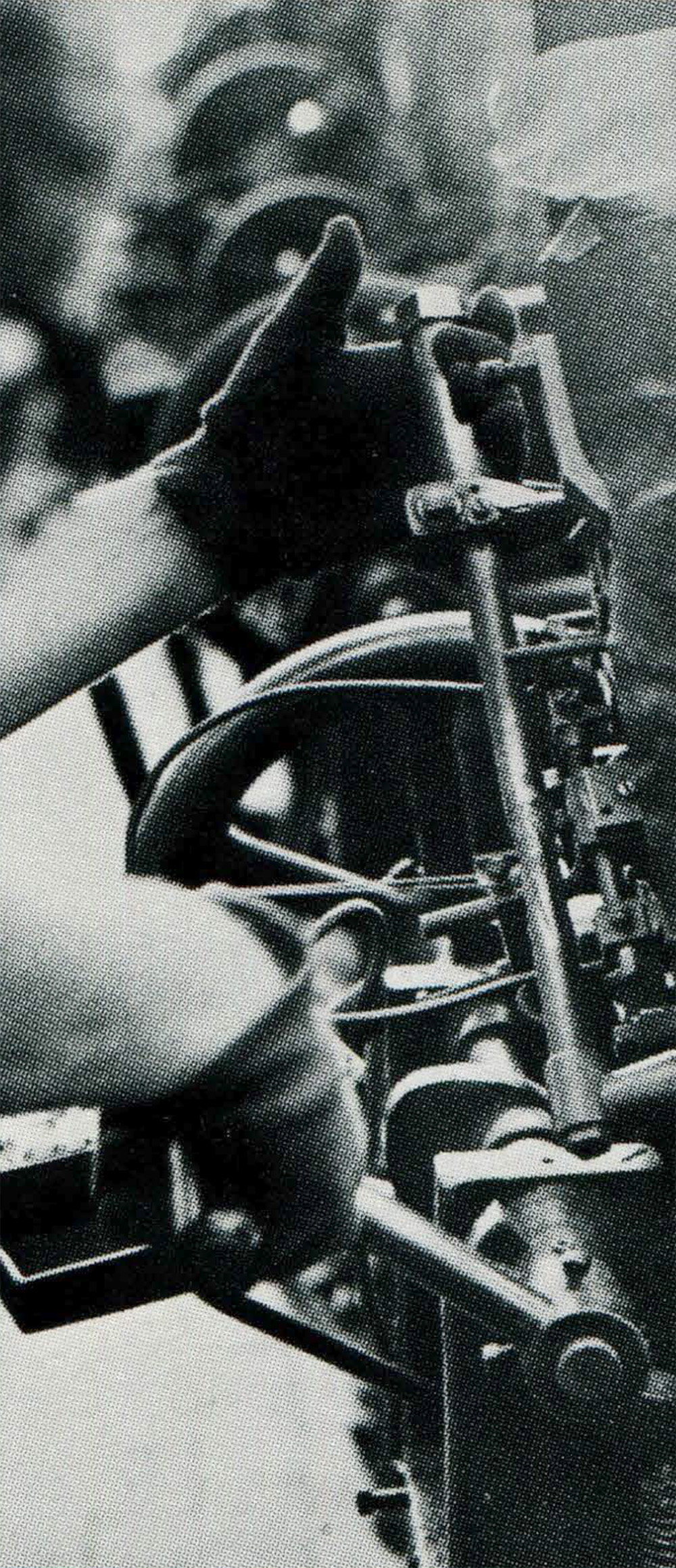 hand of an operator cranking a machine