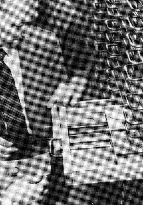 Robert Glessner inspects contents of a drawer